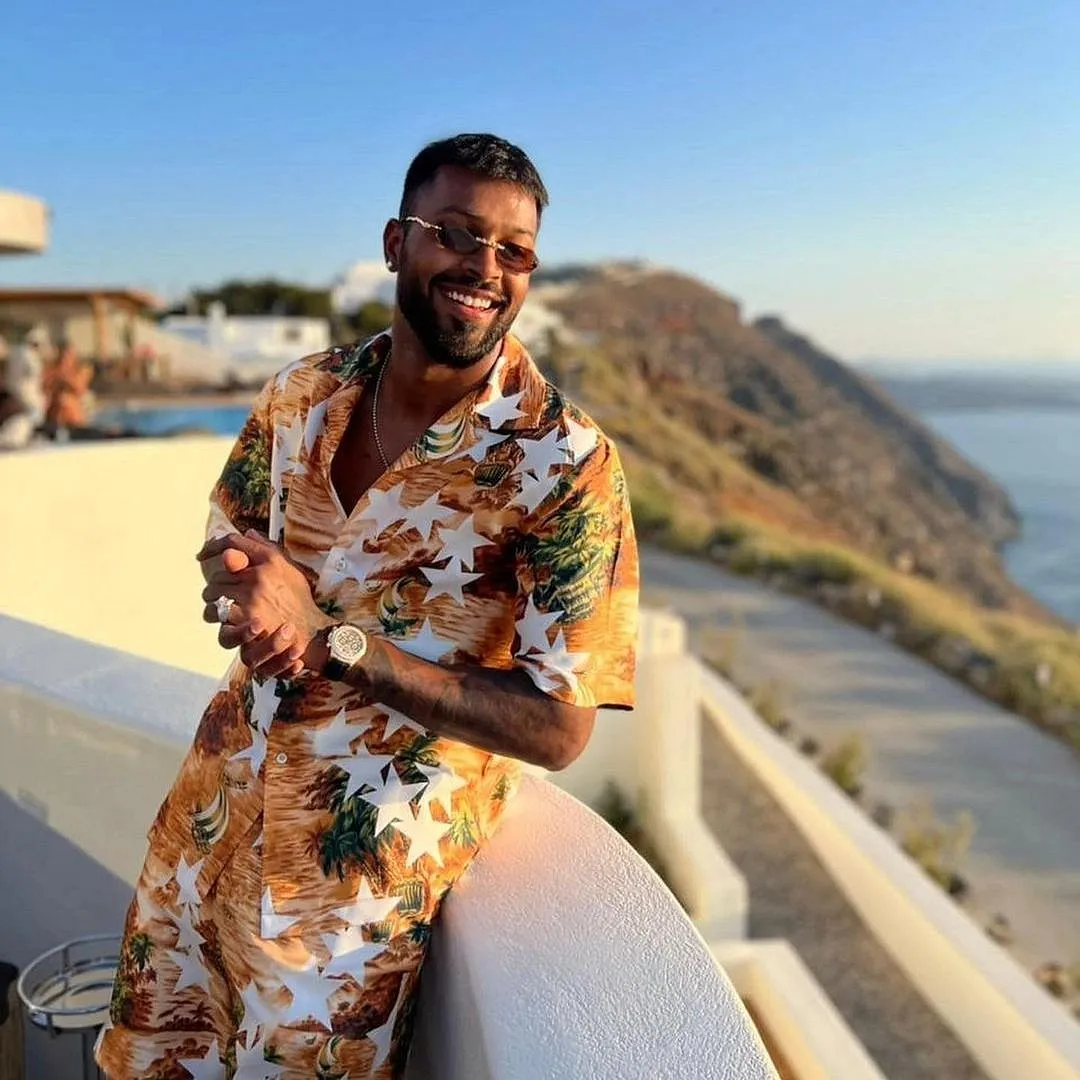 To dress up like this Mumbai Indians’ player is to wear printed cotton or satin shirts with a pair of shorts 