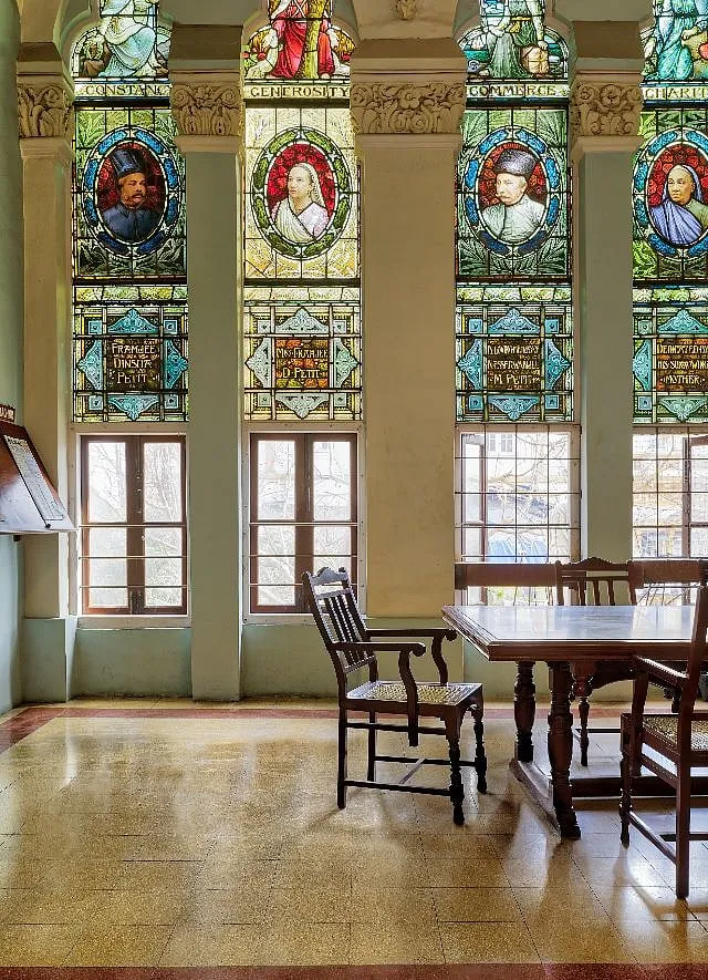 Stunning juxtaposition of stained glass and beautiful old BFT flooring at Mumbai's J N Petit Library  