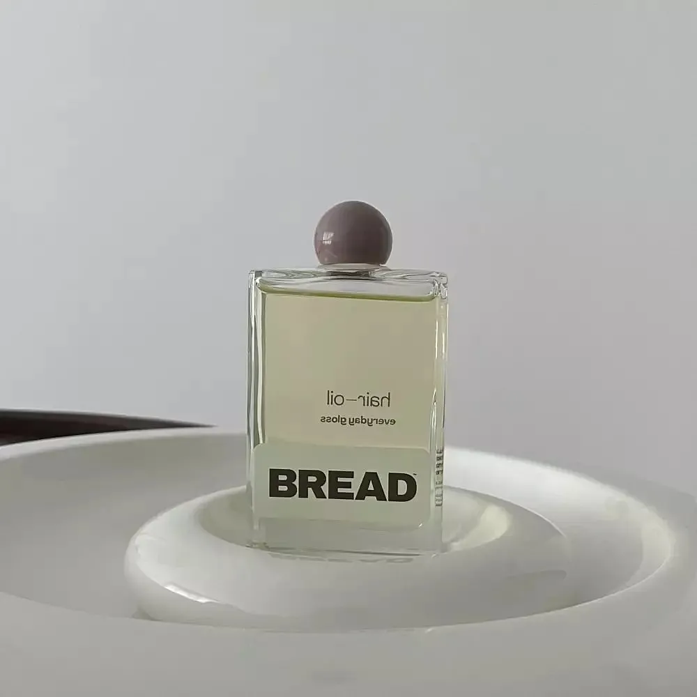 Bread Supply Hair OilShop here₹ 1,900Think of this as a lip gloss for your hair—it just serves as the perfect finishing product for your look. The mid-weight oils work for both low- and high-porosity hair, and if you have curly strands, you need a hair oil like this that’ll keep them springy without weighing them down. 