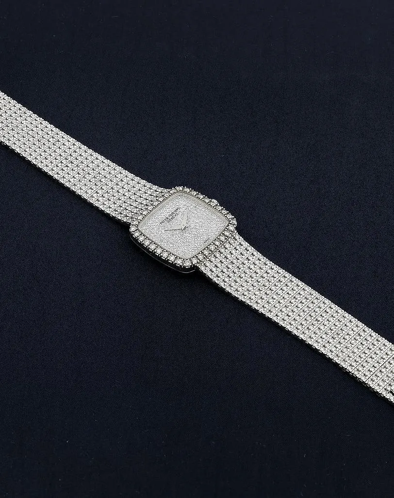 Rare 18K white gold and diamond-studded Patek Philippe with cushion-shaped case,  a diamond-set dial and bezel. The watch bracelet is flexible and also set with diamonds. Dial, case and movement signed 
