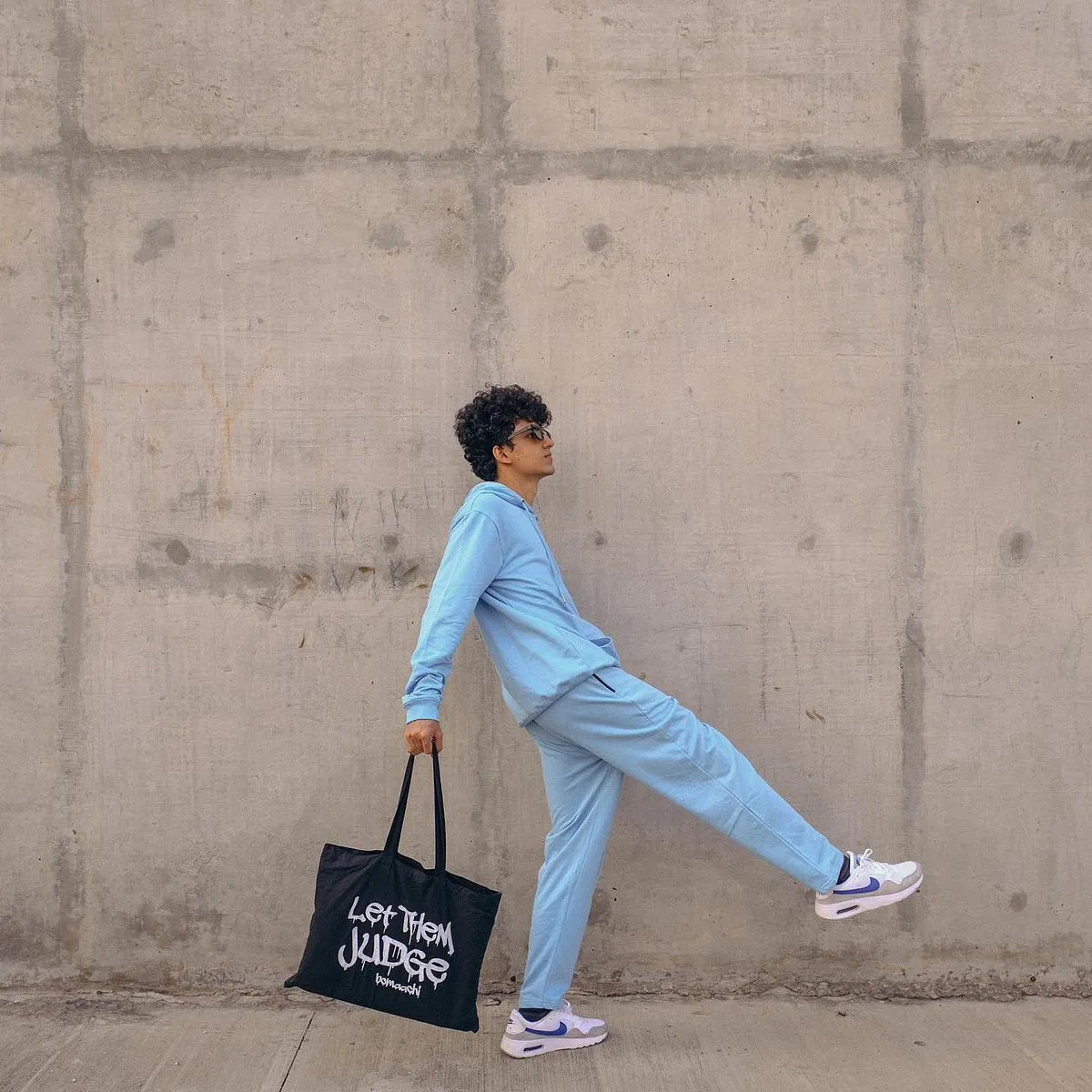 Bomaachi:Bomaachi’s philosophy is to be unfazed by the judgement of others and “not give a fu** about what other people think.” This is reflected in their rather unapologetic designs. Founded by Prince Shah in 2020, the Ahmedabad-based gender-neutral brand’s ‘Let them judge’ print can be found on T-shirts, hoodies and even tote bags, letting you be as authentic, raw and unfiltered as you want. Our picks include the ‘Feeling rich’ and ‘Too sober’ printed oversized T-shirts that can be teamed with jeans or shorts for a casual look, or under a blazer or jacket to up your street cred.Instagram: @bomaachi 