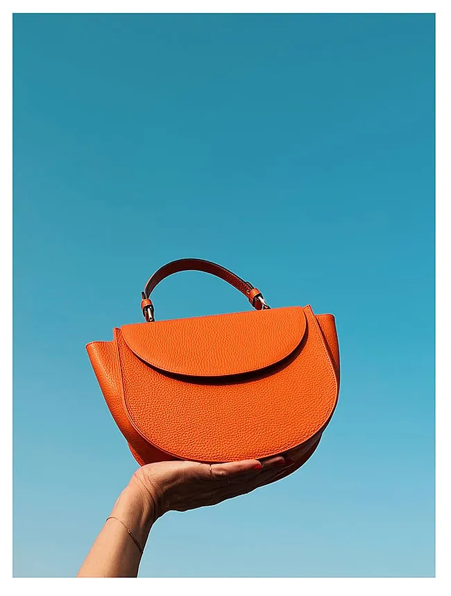 C by CynthiaMinimalist, light and fuss-free, C by Cynthia’s handbags pack a punch with their detailing. Think a deep red leather tote with contrasting braided top handles or an emerald green envelope clutch made from textured leather in a soft yet structured silhouette. Founded by Cynthia Bouchakjian in Beirut, the brand designs purses that are practical, luxurious and are distinct all at once.Shop here 