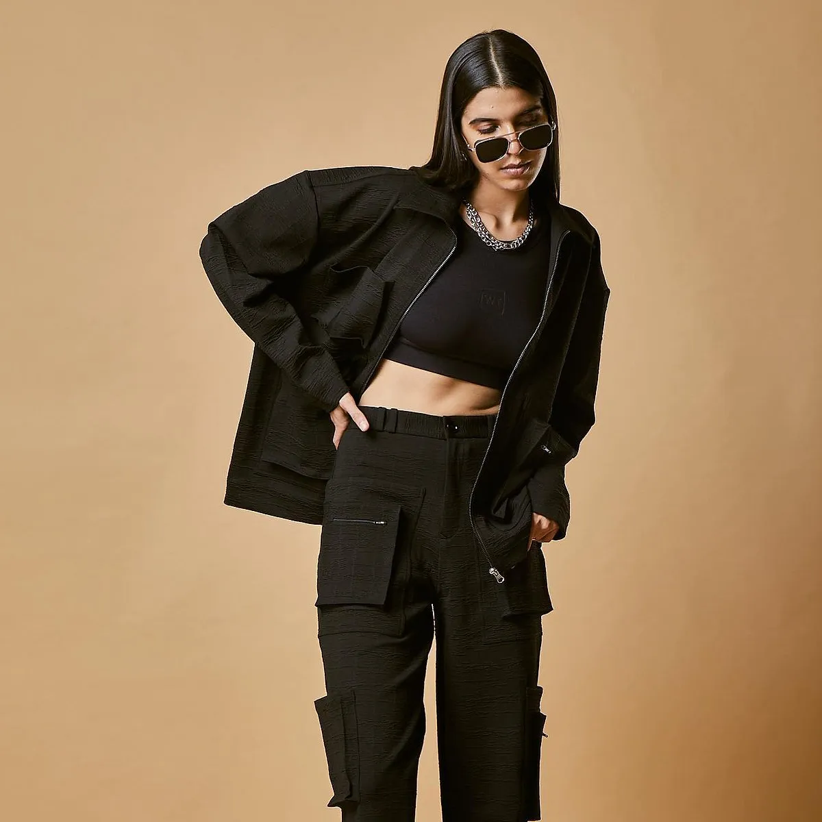 Warping Theories:Designers Kuship Parmar and Urvash Parmar fused their two independent streetwear labels Warp and Pro-Anti Theory respectively to create Warping Theories in 2021 with three core foundational concepts: minimalism, neutrality and functionality. The Mumbai-based label offers a sophisticated and unconventional take on streetwear subculture with utility cargo pants, hoodies and graphic T-shirts–all created in a neutral colour palette. Keep an eye out for their collaboration with indie Indian artists for their limited-edition collection.Instagram: @warping_theories 