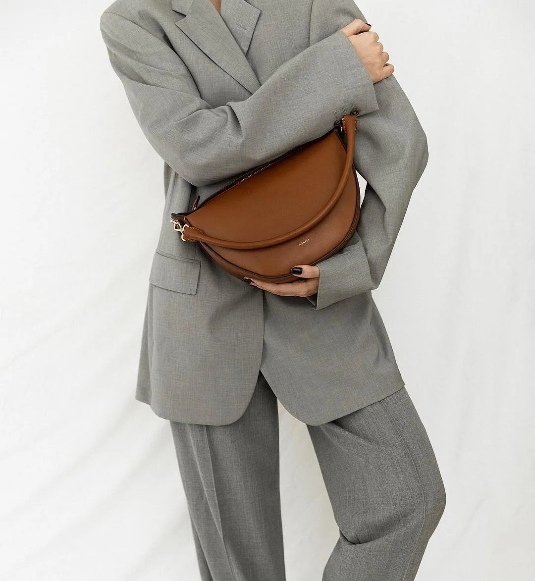 AgneelAgneel is a name that’s becoming increasingly familiar to the street-style set and those who live by the “less is more” philosophy. Carefully crafted at family-run workshops in Izmir and Florence, the Berlin-born brand’s understated bags are characterised by timeless shapes, earthy colours, a barely-there logo and an overall aversion to excess. What makes the designs even cooler is the fact that they are named after women and have an all-women team behind them. Agneel.com 