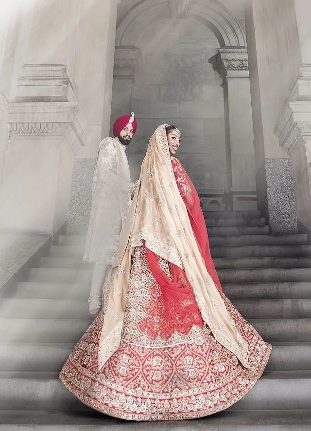 The bride wore a a classic red lehenga by Manish Malhotra for a traditional Sikh ceremony 