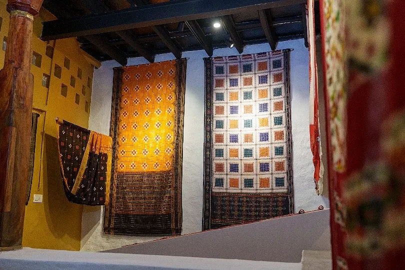 Handwoven textiles, like ikats,  hung as a pat of the exhibition  