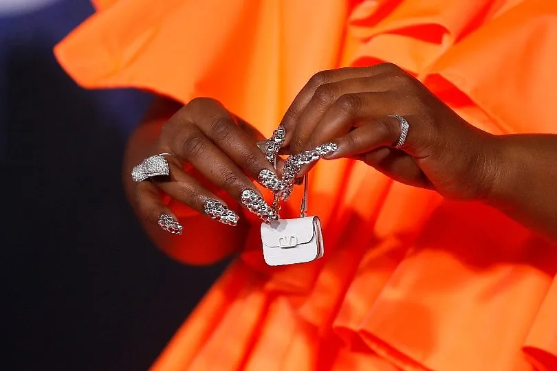 The ridiculously tiny Valentino purse sported by Lizzo 