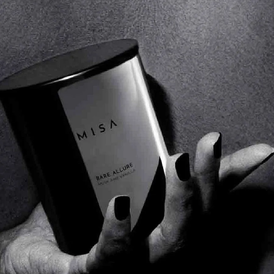 Bare Allure, MISAThis candle exudes a meld of intense and evocative musk and creamy vanilla, striking the perfect balance between sweet and woody. The luxe-looking metallic jar that holds the soy candle makes for a stellar home decor piece too. Devised in France, the candle will engulf your home in its balanced yet lingering aroma. 