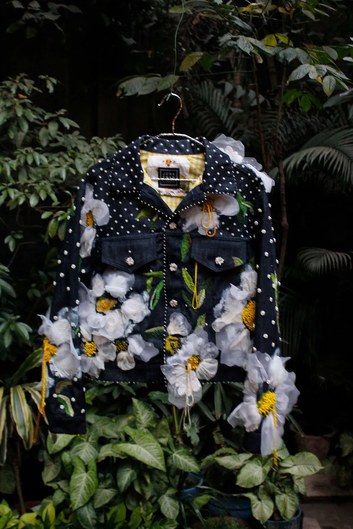 Some of the jackets have spray-painted daisies  to give the illusion of them exploding 