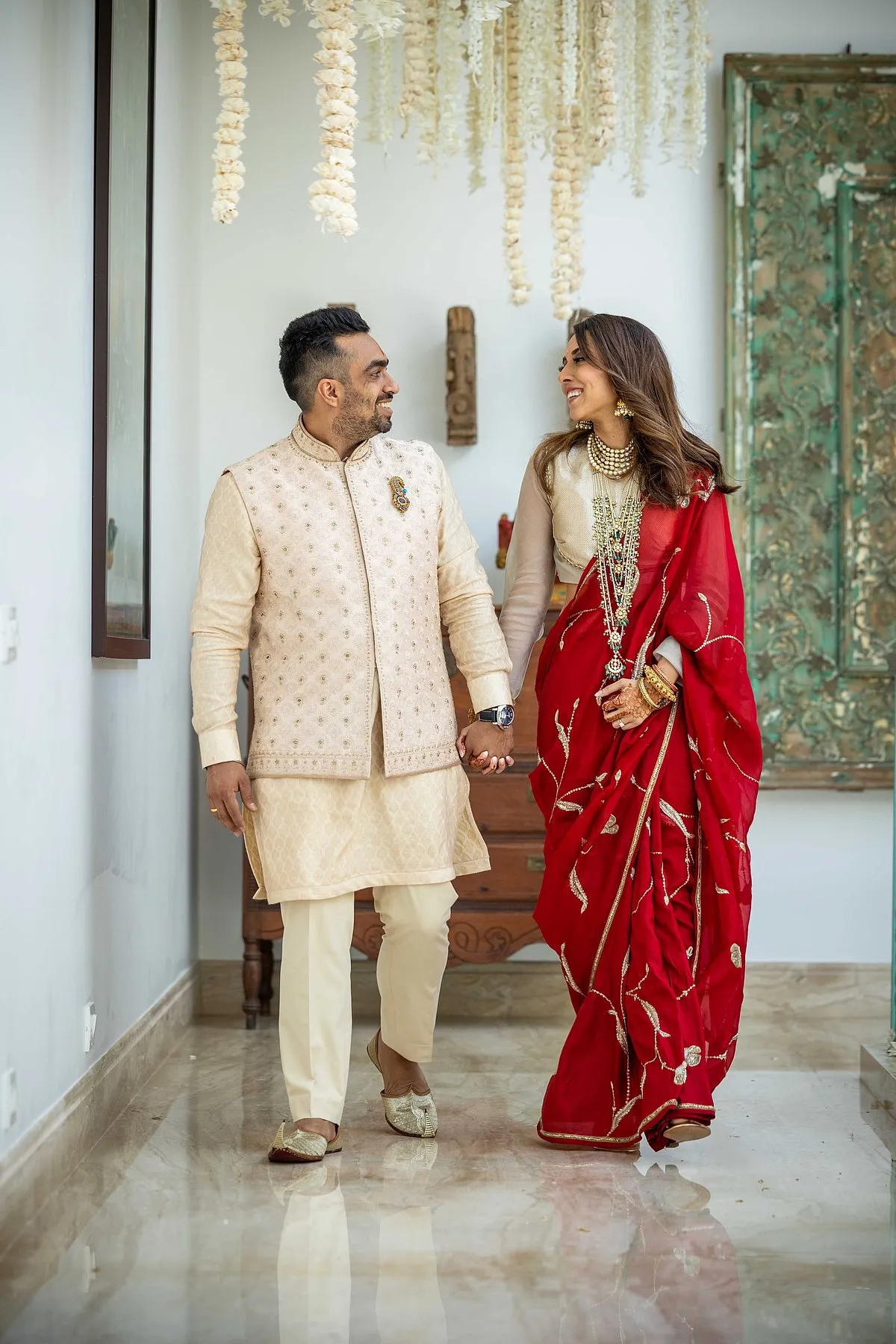 Chaitanya wore a saree by Raw Mango with silver work with floral elements. The blouse had vintage metallic gold and silver work, which she got customised with a high neck and long sleeves  cory goldberg photography