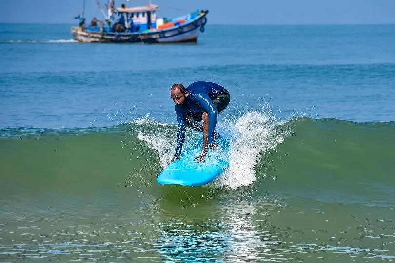 A surfer rides the waves 