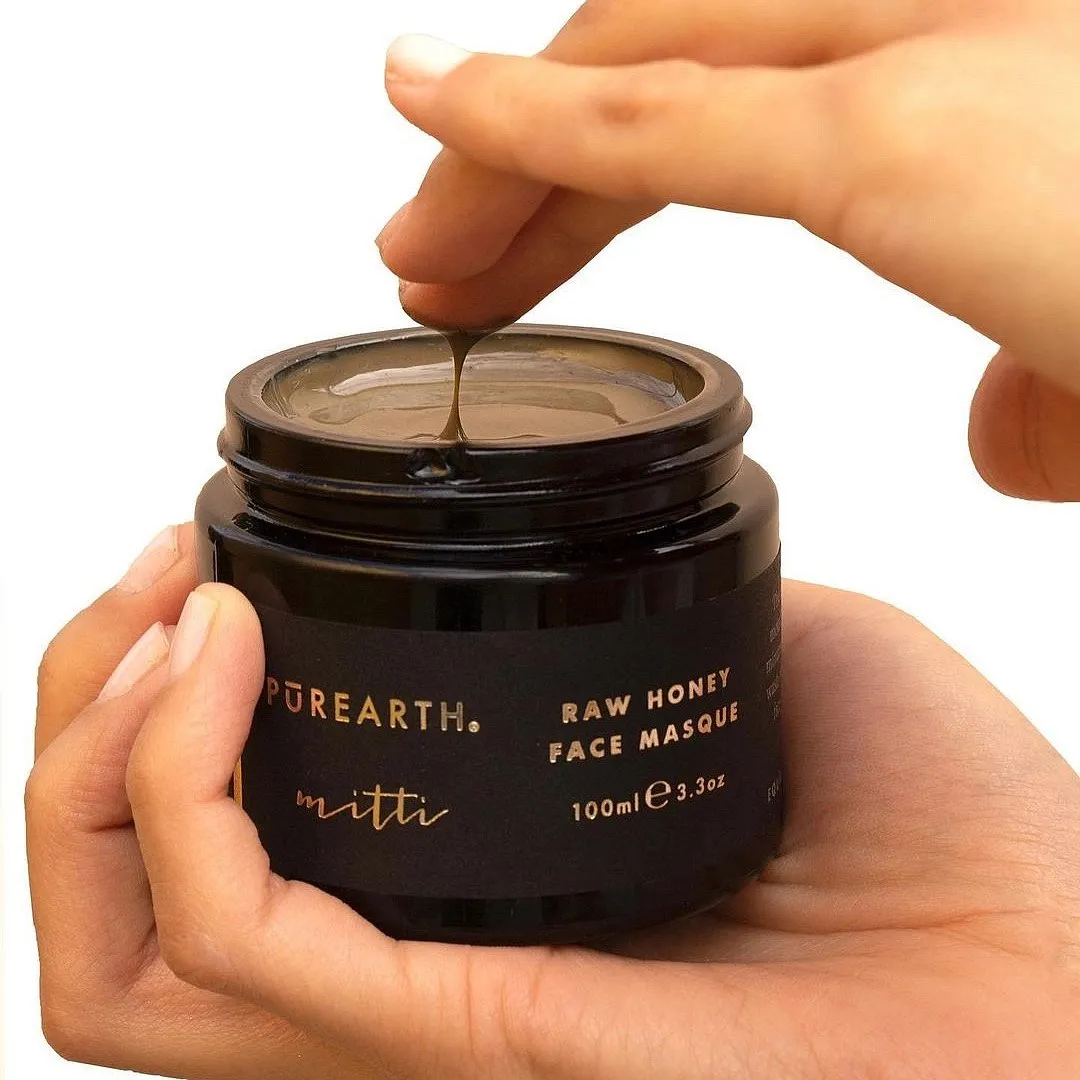 Mitti Raw Honey Face Masque, Purearth This creamy lepa-textured mask contains honey and multani mitti along with other botanical ingredients like rose, gotu kola, neem, manjistha, cinnamon and ylang ylang. Besides the lush feel it imparts, this award-winning face mask is a remedy for skin affected by pollution The mask’s purifying formulation soothes the skin and reduces the appearance of pigmentation and fatigue.Priced at ₹6,300Shop hereImage: Instagram.com/purearth 