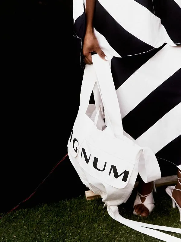 The collaboration features limited edition tote bags and a classic white shirt that embody the shared ethos of the two brands: inclusivity, functionality and new 