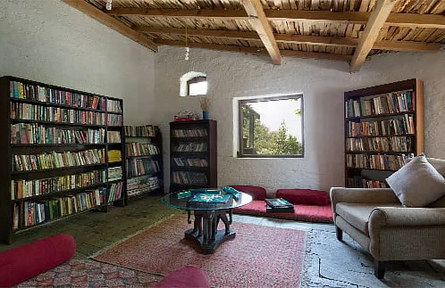 Sitla Estate, Mukteshwar (Uttarakhand)Sitla Estate is a charming 150-year-old part mud, part stone house that sits cocooned in the foothills of the Kumaon Himalayas. The homestay’s library consists of books that the Maira family has collected for years and passed down from generation to generation. This sprawling, 40-acre family estate is a paradise for those looking to switch off and spend their days tucked away with a book (or few) in hand – whether inside the homestay’s cosy library or under a blooming apricot tree. 