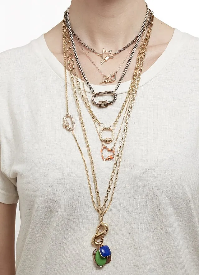 Aaron's jewellery include locks in the shape of stars, crescents, Bowie-inspired lightning bolts, infinity symbols and triangles 