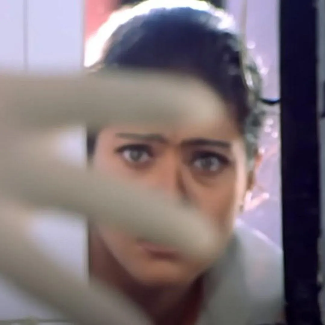 A still from Tanuja Chandra's directorial debut Dushman (1998), a psychological thriller where a pair of twins, played by Kajol, are preyed upon by a serial rapist and murderer, played by Ashutosh Rana. Image: YouTube 