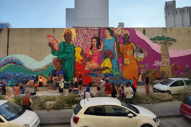 The most recently painted mural by the Fearless Collective titled We Are Each Other's Sanctuary in Marseilles, France 