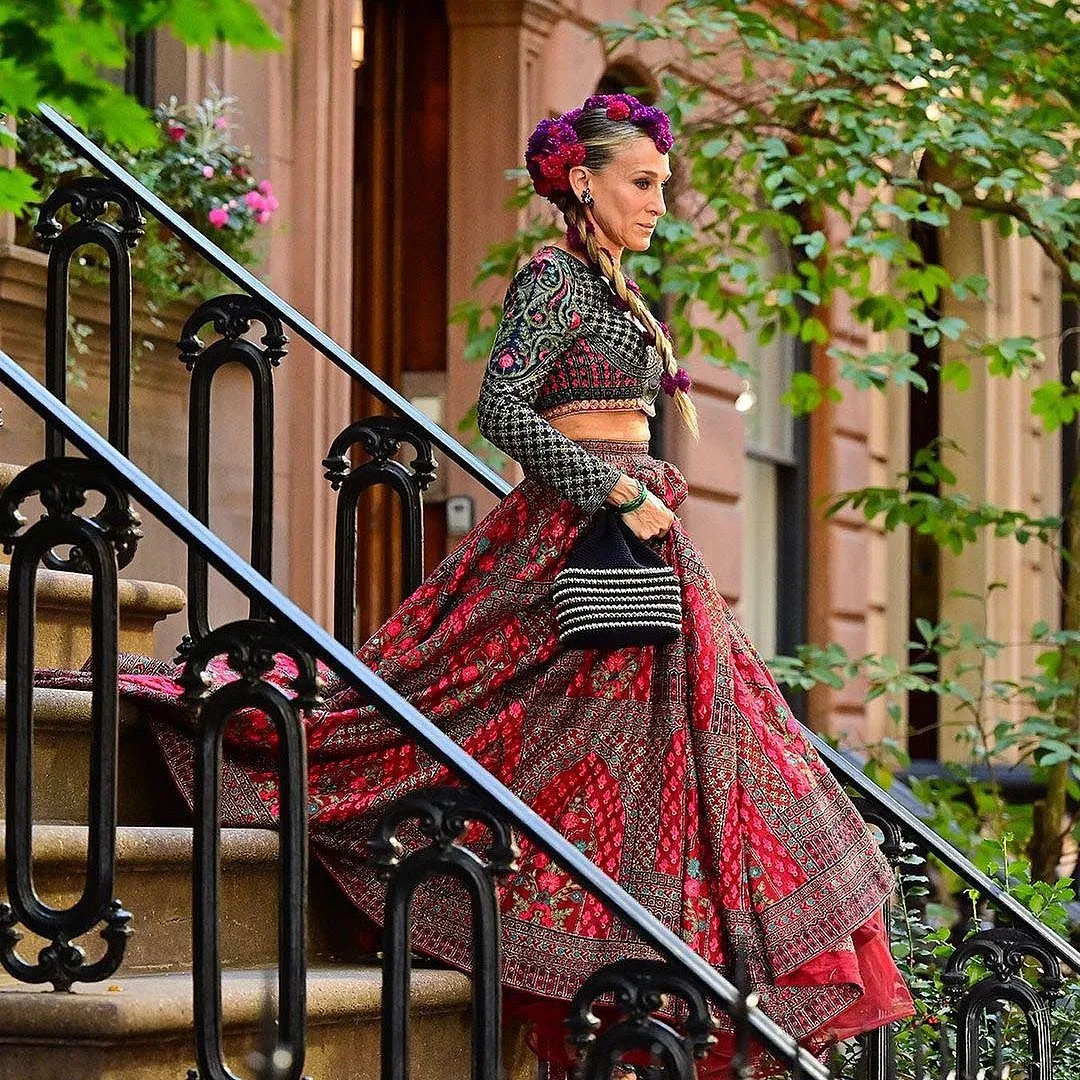 When Carrie Bradshaw walked out of her iconic, 64 Perry Street brownstone in New York City on HBO Max’s …And Just Like That in a maroon-and-cobalt blue Falguni Shane Peacock lehenga, there was an uproar on the Internet. Image: Instagram.com/falgunishanepeacock 