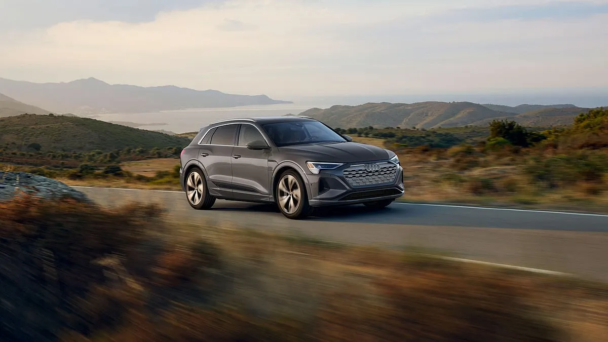 Audi Q8 e-tronThe Audi Q8 e-tron SUV and Sportback are updated versions of the previously released e-tron SUVs. Along with cosmetic improvements, they now bear the name Q8. The exterior design boasts a newly reworked grille, lights, bumpers and tailgate, giving the SUV a sharper, sportier look. The top-of-the-line Audi electric SUVs also feature electrically adjustable front seats with memory function, heating, ventilation and massage controls. The centre console includes two touchscreen units, with a 10.1-inch infotainment system at the top and an 8.6-inch screen at the bottom for climate control. In addition, the Q8 e-tron range includes:A Bang & Olufsen sound systemA panoramic sunroofA 360-degree cameraFour-zone climate controlTPMSFrom ₹ 1.14 crore 