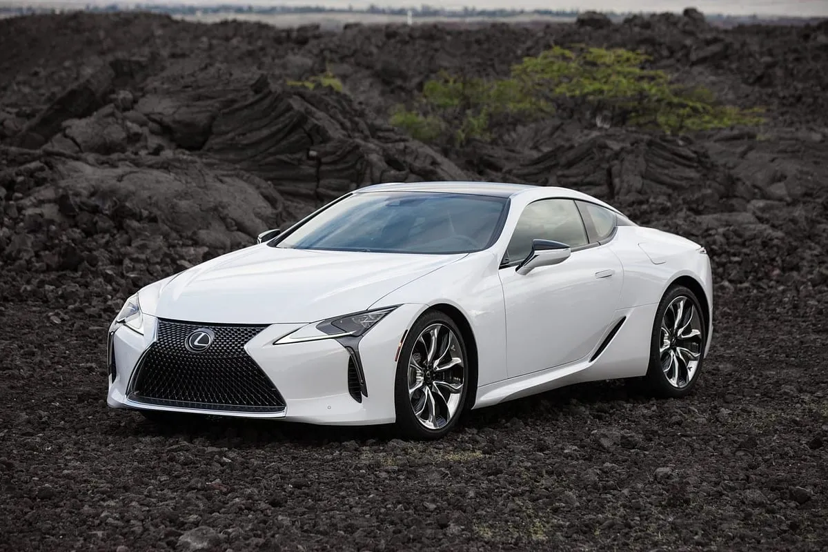 Lexus LC500h Limited EditionThe Lexus LC 500h Limited-Edition Sports Coupe is a sophisticated fusion of elegance and performance, arriving in a unique 'Hakugin' pearlescent paint with a subtle satin finish—a sleek contrast to the black elements on its front grille and rear diffuser. This special edition, of which only a few will grace the roads, brings cosmetic finesse and enhanced aerodynamics with front bumper canards and a carbon-fibre rear wing. It rolls on stunning 5-spoke Matte Black-finished 21-inch alloy wheels, while its interior features a new Kachi-Blue theme adorned with Alcantara upholstery and a limited-edition scuff plate. Under its hood, the LC 500h houses a potent 3.5-litre V6 and an electric motor-generators hybrid system, delivering a combined  power output of 354bhp, all managed by a 10-speed hybrid automatic gearbox, promising a thrilling and environmentally-conscious drive. It also features an extensive infotainment system—a large 12.3-inch display, a Takumi steering wheel suitable for circuit driving, and a premium Mark Levinson 13-speaker sound system.  Price: ₹ 2.5 crore 