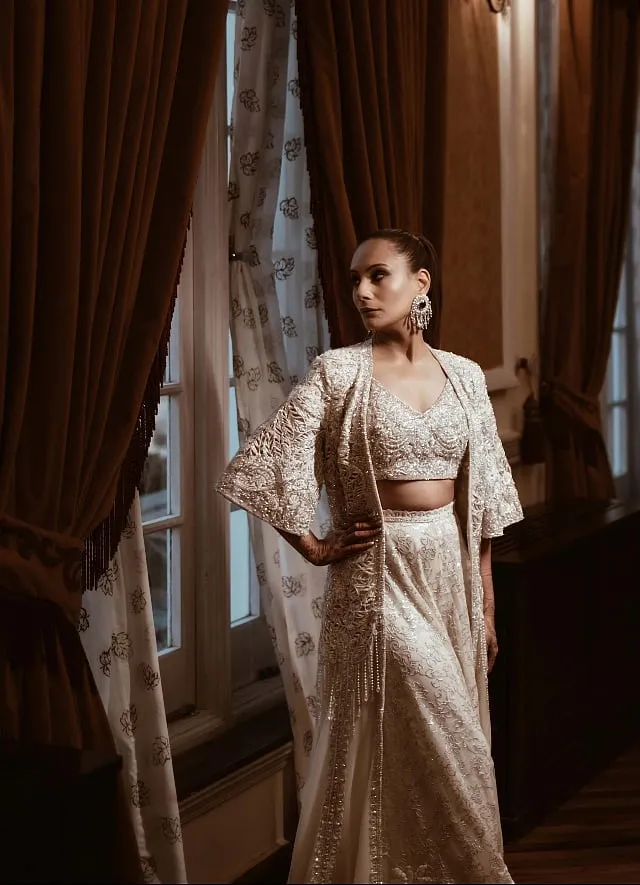 For the sangeet sundowner, the bride opted for a comfortable yet elegant ivory silver sharara and jacket by Zain Hashmi 
