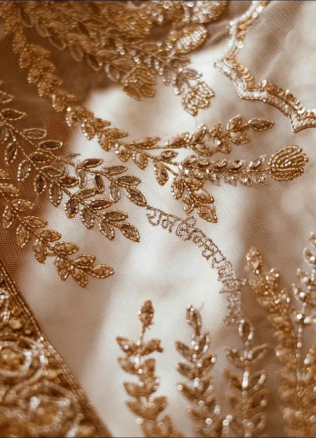 Sablok's bridal outfit included a  dupatta that drew inspiration from the tulips of Kashmir and was adorned with a Mughal-inspired cutwork border and as a special touch, the designer discreetly inscribed ‘Raj Simran’ in the Devanagari script inside—an exquisite keepsake 