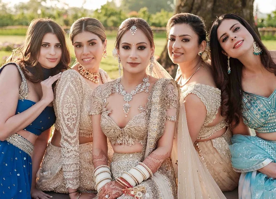 Sablok worked with her designer to create her wedding outfit—a mixed-media lehenga featuring Mughal motifs, landscapes and wall textures with a starburst tulle veil, lending a modern twist to the ensemble 