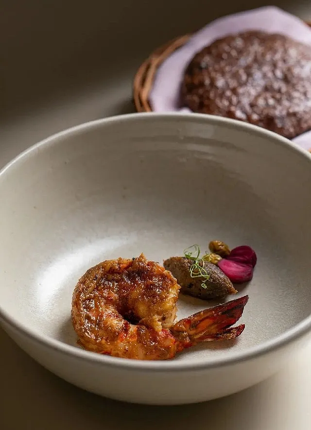 Tiger prawn served with chana dal miso, malvani masala, with sprouted ragi bhakri. Image: Noon 