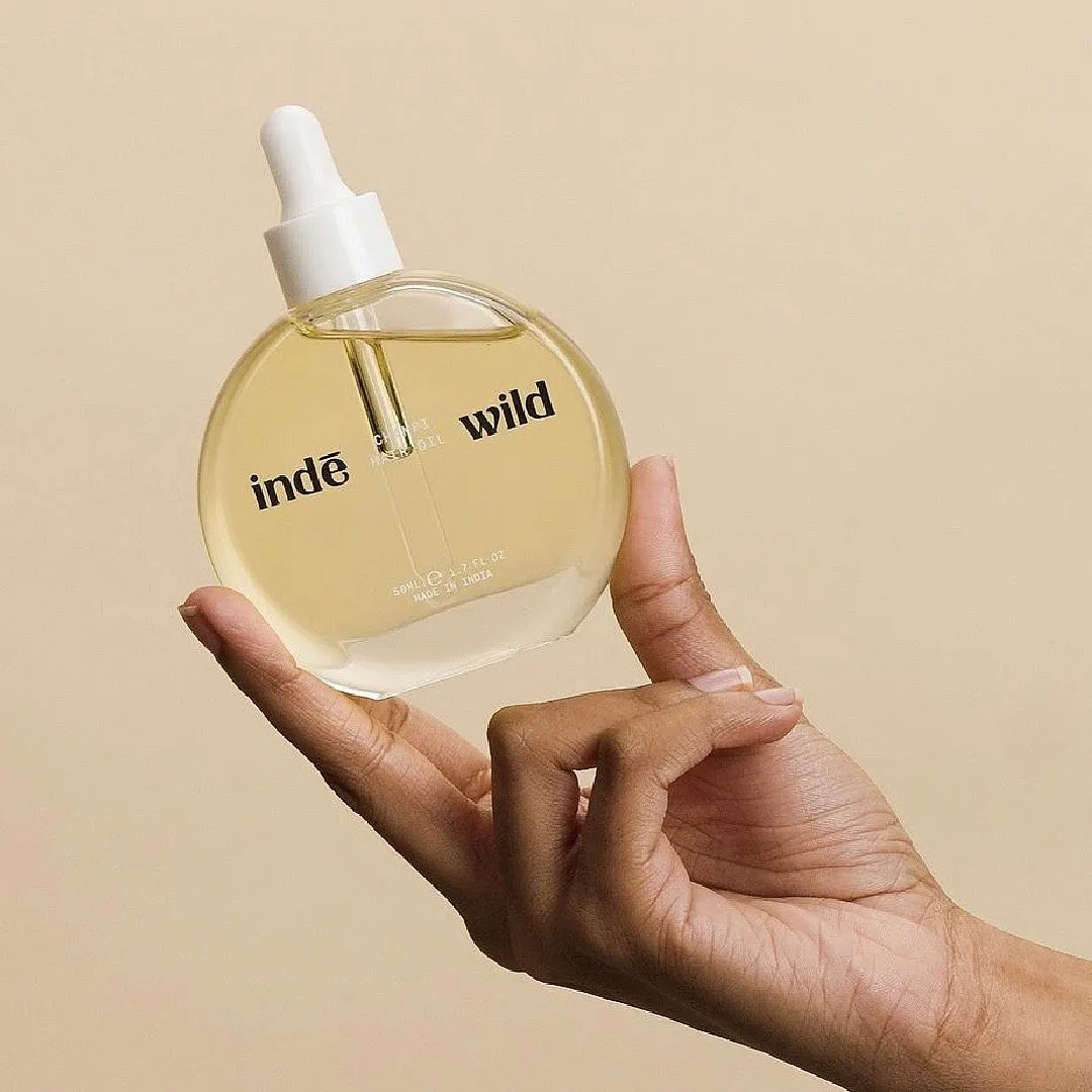 Champi Hair Oil, indē wildWhat it is: A lightweight hair oil (best for massages, or champis)What it does: Nourishes the scalp and hair, mitigates dandruff and prevents scalp infections, heals a dry scalp, and helps with attaining longer and thicker hair.Best suited for: All scalp and hair types.The plus: The act of hair oiling has prevailed in Ayurvedic beauty traditions for centuries, and currently, it’s having its moment again. If you wish to sign up for hair oiling, give this product a shot. it is super lightweight despite containing coconut and sesame oils and smells like a bouquet of fresh jasmine flowers. Dandruff, dryness, flakiness, and unhealthy, brittle and lacklustre hair is what this hair oil will effectively target over regular use, courtesy of its botanical ingredients.The minus: Since the product comes with a dropper applicator, reaching the end of the bottle when the product is about almost used up could be a little tough. Secondly, it contains coconut oil which might be a problem for those who have active forehead acne.Available at: indewild.comPriced at: ₹949 onwards 
