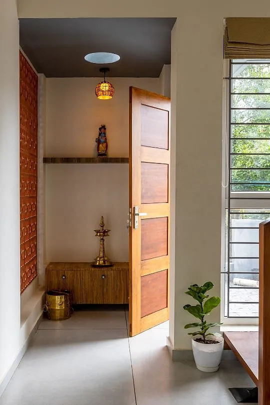 The puja room sits next to the terrace overlooking the backyard 