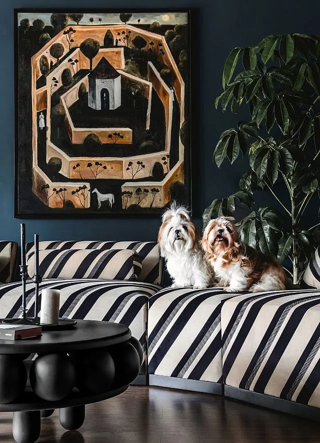 The clients' two furchildren, Momo and Mimo, in the frame. The vintage art visible here have been framed and styled. 