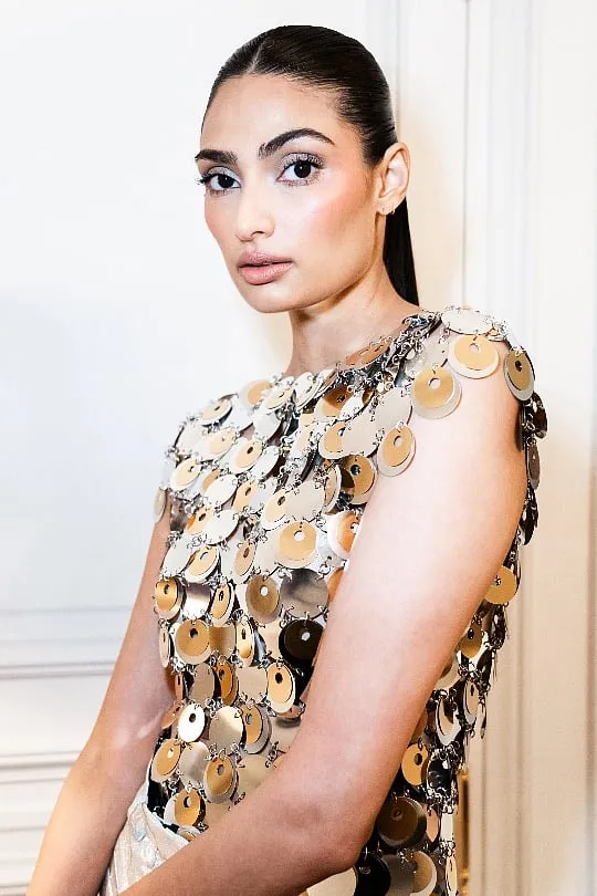 Actor Athiya Shetty in a Rabanne ensemble from the Rabanne X H&M collaboration featuring gold and silver paillette discs made from recycled PET 