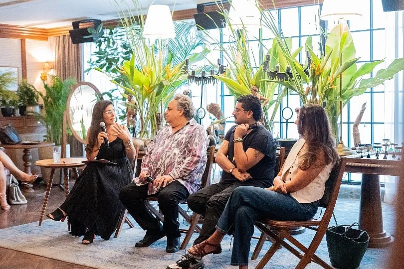 “We want to provide a platform for emerging creatives to flourish in their careers and lives,”  says Bellas (pictured here: fashion talk with Hanut Singh) 