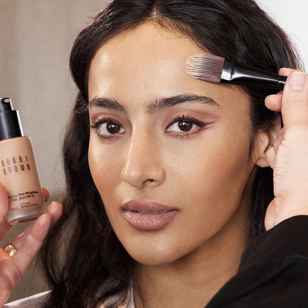 Bobbi Brown Skin Long-Wear Weightless Foundation SPF 15 Foundation Want a dewy and fresh look? Bobbi Brown Skin Foundation is a water-based formula that provides a surge of hydration, leaving your skin plump and glowy all day. The oil-free formula blends seamlessly for a second-skin finish that minimises imperfections. Moreover, SPF 15 protects your skin from sun damage. Bobbi Brown Skin Foundation is perfect for those looking for a natural, healthy-looking complexion with a touch of glow.Priced at: ₹4,900Available at: Nykaa, Tira, Sephora, TataCliQ 