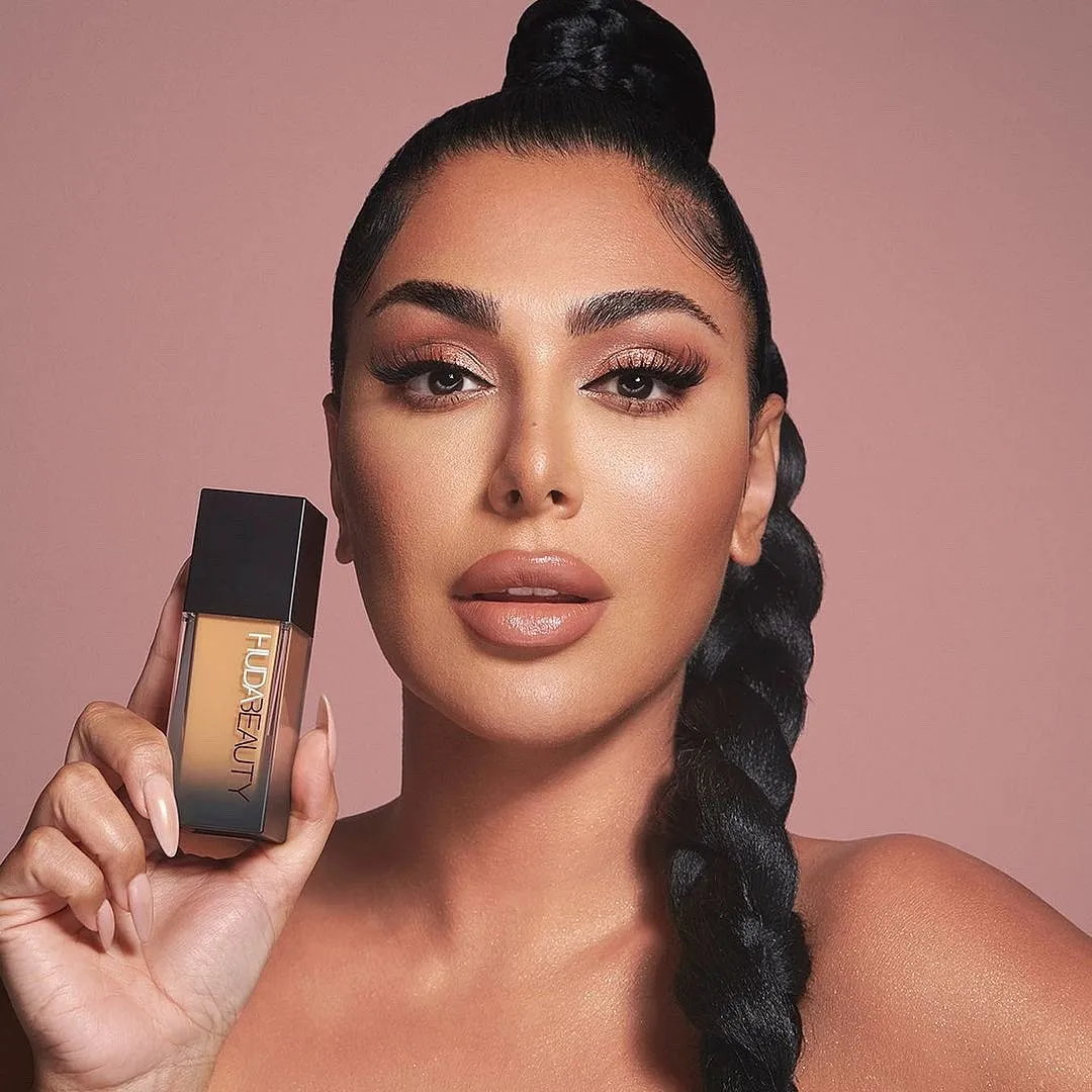 Huda Beauty Fauxfilter Luminous Matte Full Coverage Liquid Foundation#FauxFilter Luminous Matte is your key to lustrous skin and full-coverage perfection. This lightweight liquid foundation is one of the best makeup foundations in India as it melts into the skin, blurring imperfections for a smooth finish. Sweat, rain, or humidity won't budge on this foundation. With over 40 shades to choose from, its oil-control properties keep you shine-free all day.Priced at: ₹3,600Available at: Nykaa, Tira, Sephora 