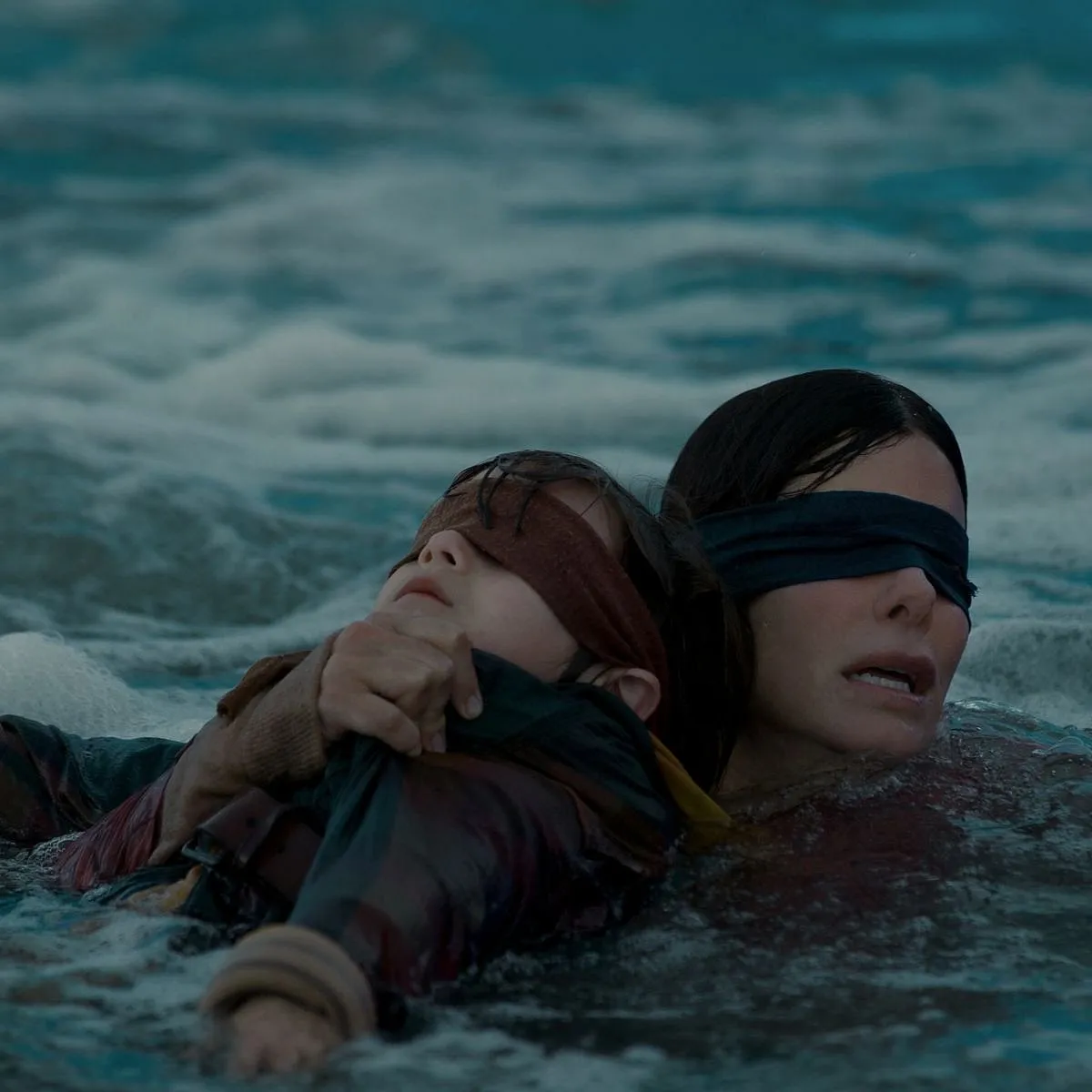 Bird Box: This Susanne Bier-directed horror flick starring Sandra Bullock, John Malkovich, and Sarah Paulson is definitely among the scariest movies to watch. In this survival drama, a mysterious force runs amok, eating through the population. Everything is in disarray—the only thing that’s certain is that if you see it, you die. The survivors, therefore, must dodge the entity that takes the form of their worst fears. In search of sanctuary, a woman and her kids make their way through the perilous woods and down a river, but there’s a catch: they'll have to cover their eyes from the evil that chases them, and undertake the journey blindfolded.Where to watch: NetflixImage: Netflix 