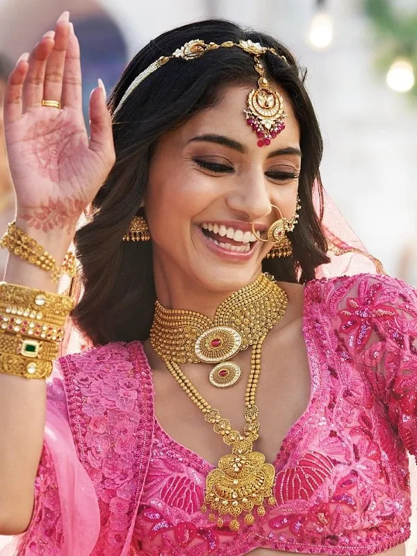 You do not need to invest in heavy bridal jewellery sets if they don't match your personal style just for the purpose of investing.  Image: @tanishqjewellery 