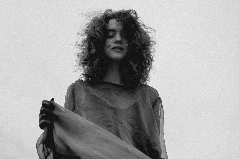 Whenever possible, try to air-dry your curls instead of using heat-styling tools. You can also braid your damp hair to make it dry faster. Image: Pexels 