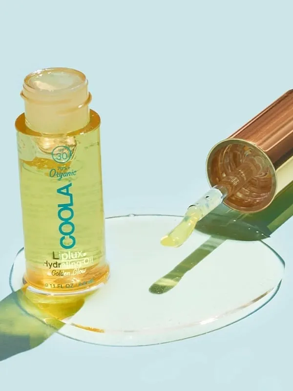 Enriched with camellia and jojoba, Coola's Liplux Golden Glow Hydrating oil is a travel favourite. Image: Instagram.com/coola 