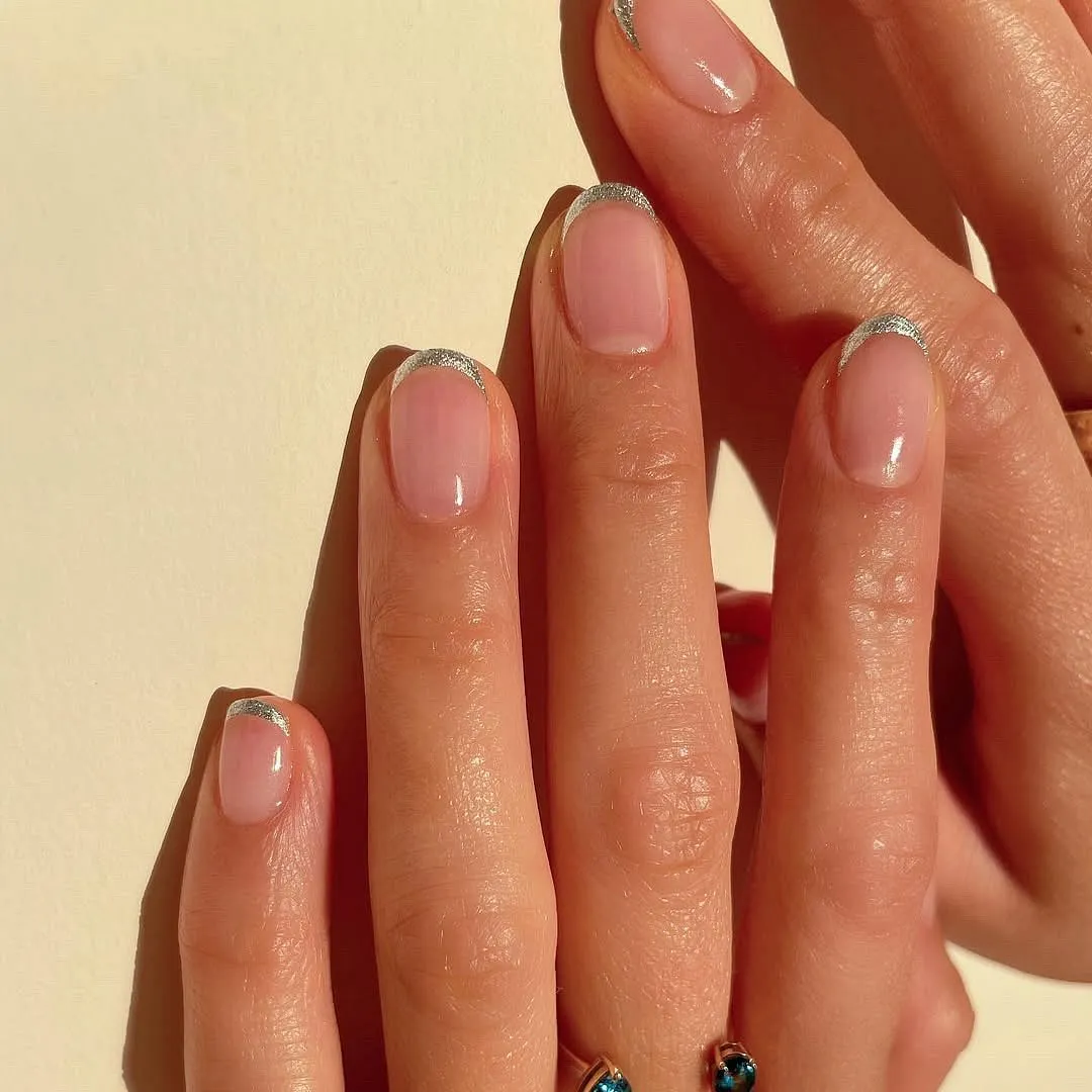Micro-French manicures with a shimmer accent can be the perfect nail art for an occasion. Image: Instagram.com/betina_goldstein  