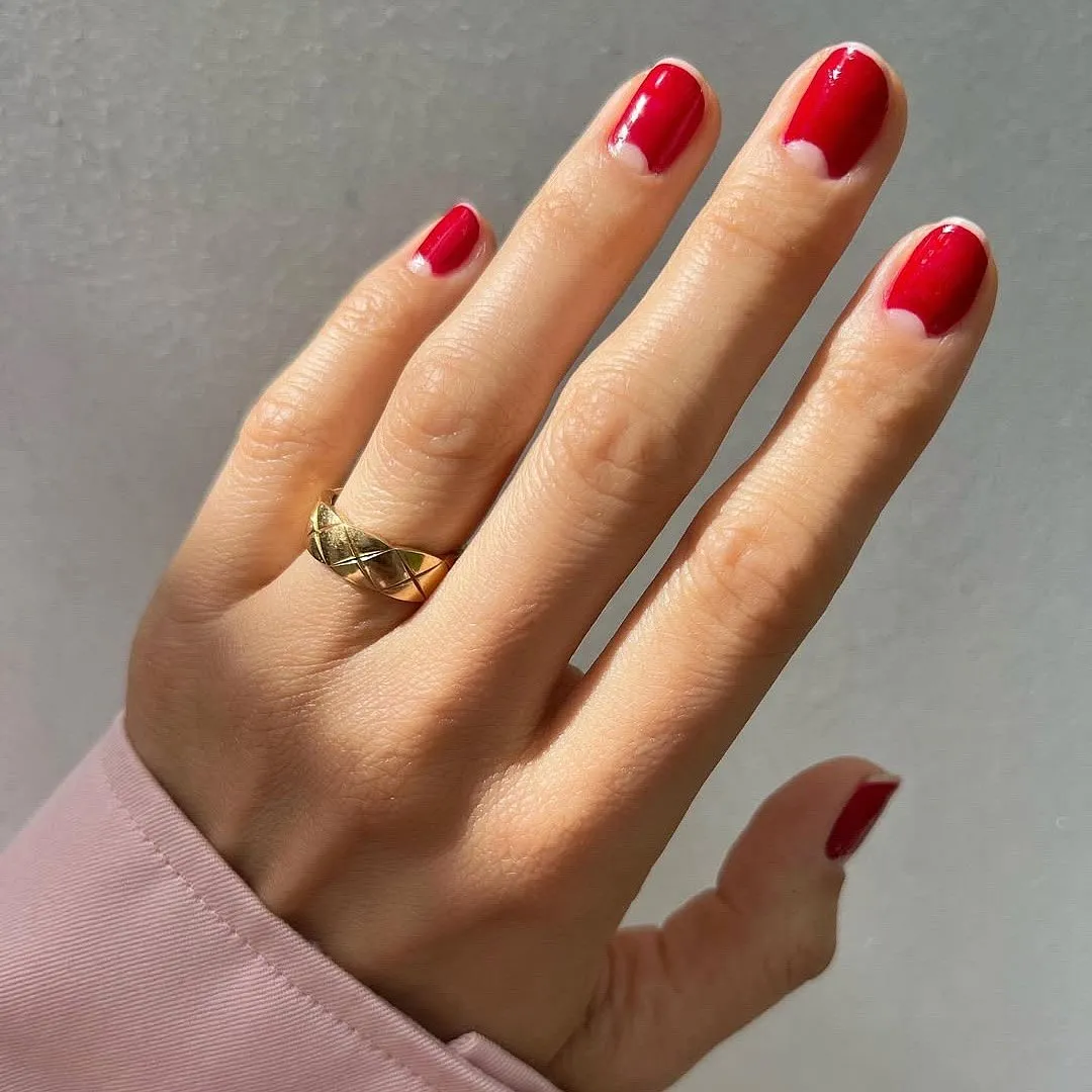 A subtle crescent at the nail base in half-moon highlights keeps it minimalist yet distinct. Image: Instagram.com/betinagoldstein 