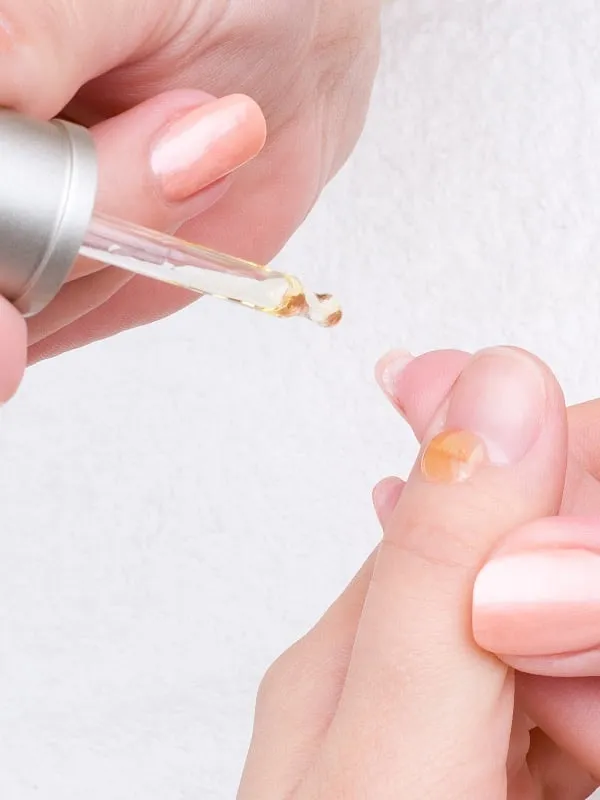 Cuticle oil is essential for rehydrating and revitalising nail beds and the surrounding cuticles after extensions. Image: Unplash  Serghei Starus