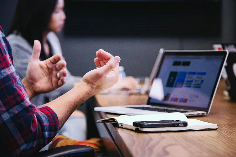 Visual cues like a “do not disturb” sign can signal colleagues to respect your focus time. Image: Unsplash 