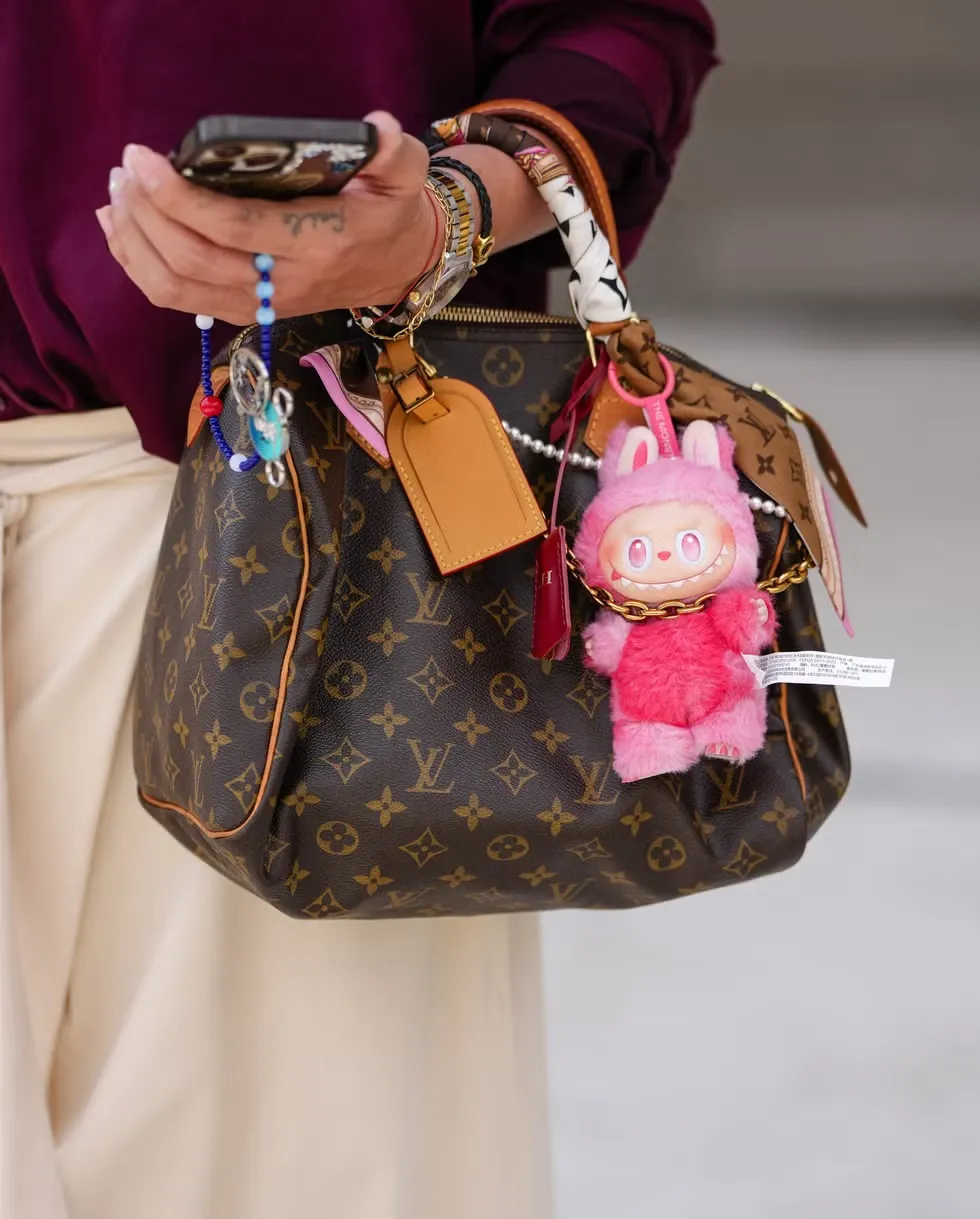 guest-wears-a-loose-fitting-deep-burgundy-button-up-shirt-news-photo-1767024613