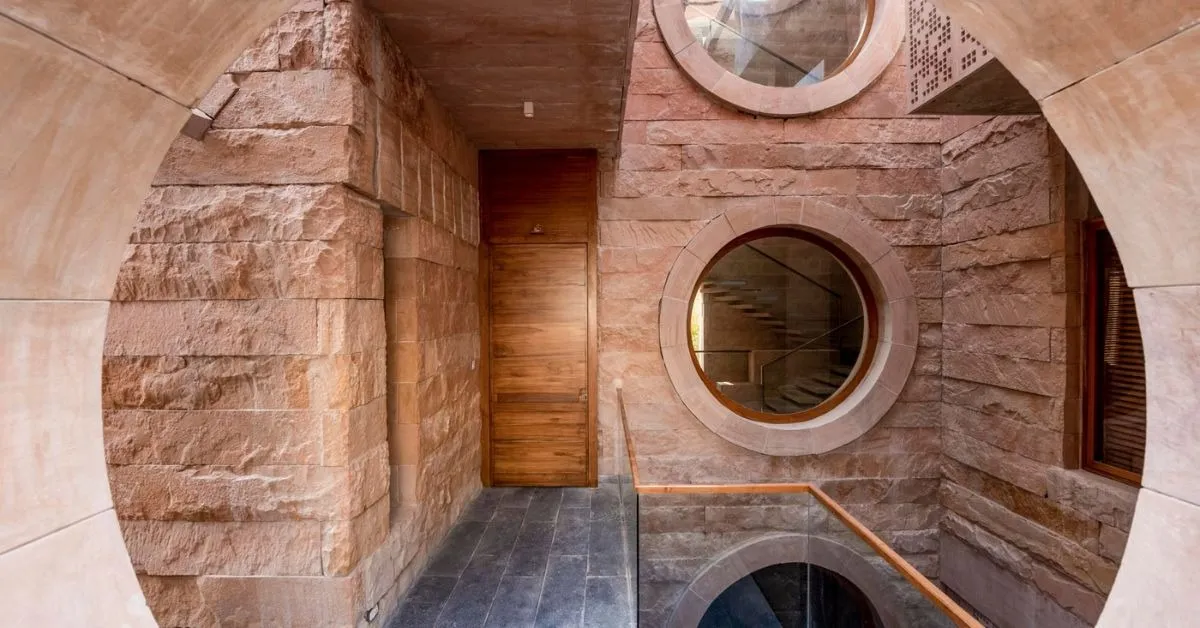 The house revives traditional load-bearing techniques while integrating modern engineering for sustainability and efficiency