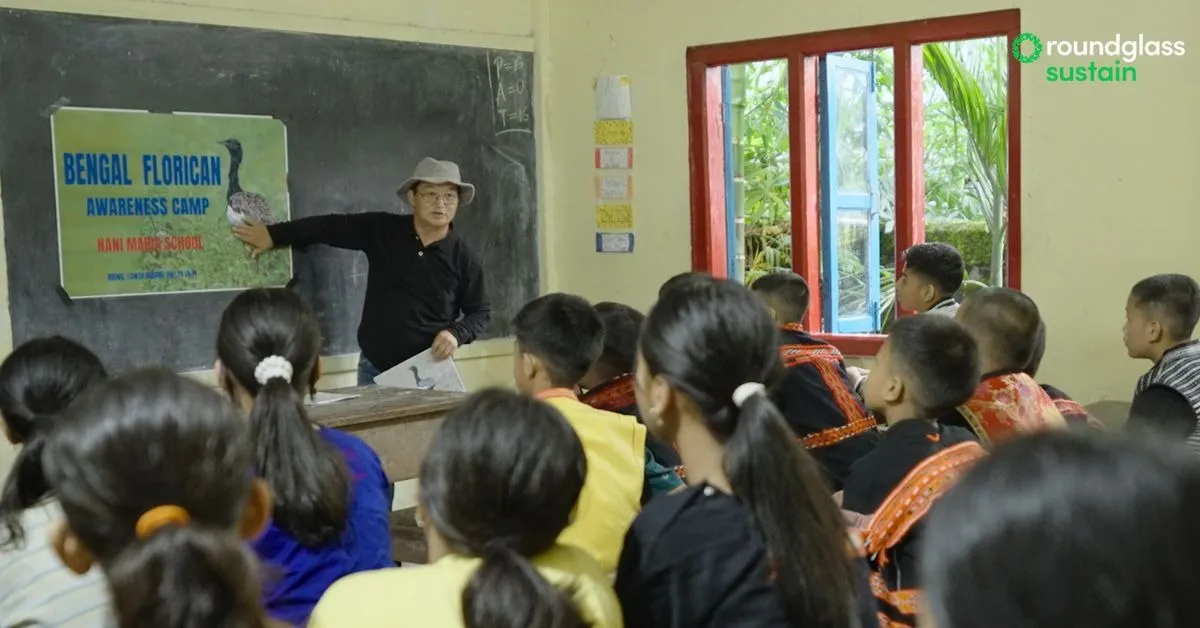 Ipra Mekola spreading awareness about the Bengal florican among students in his community
