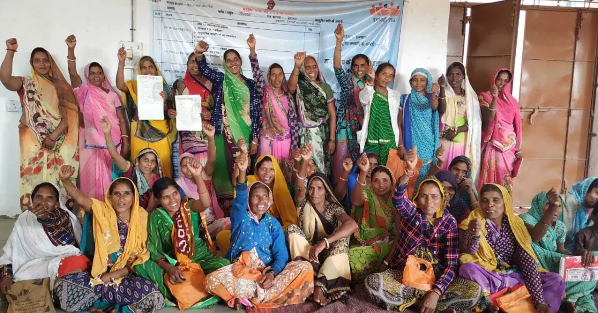 Members of Ujala Samooh celebrate after organising a Mahila Sabha to highlight women’s worksite and welfare issues.