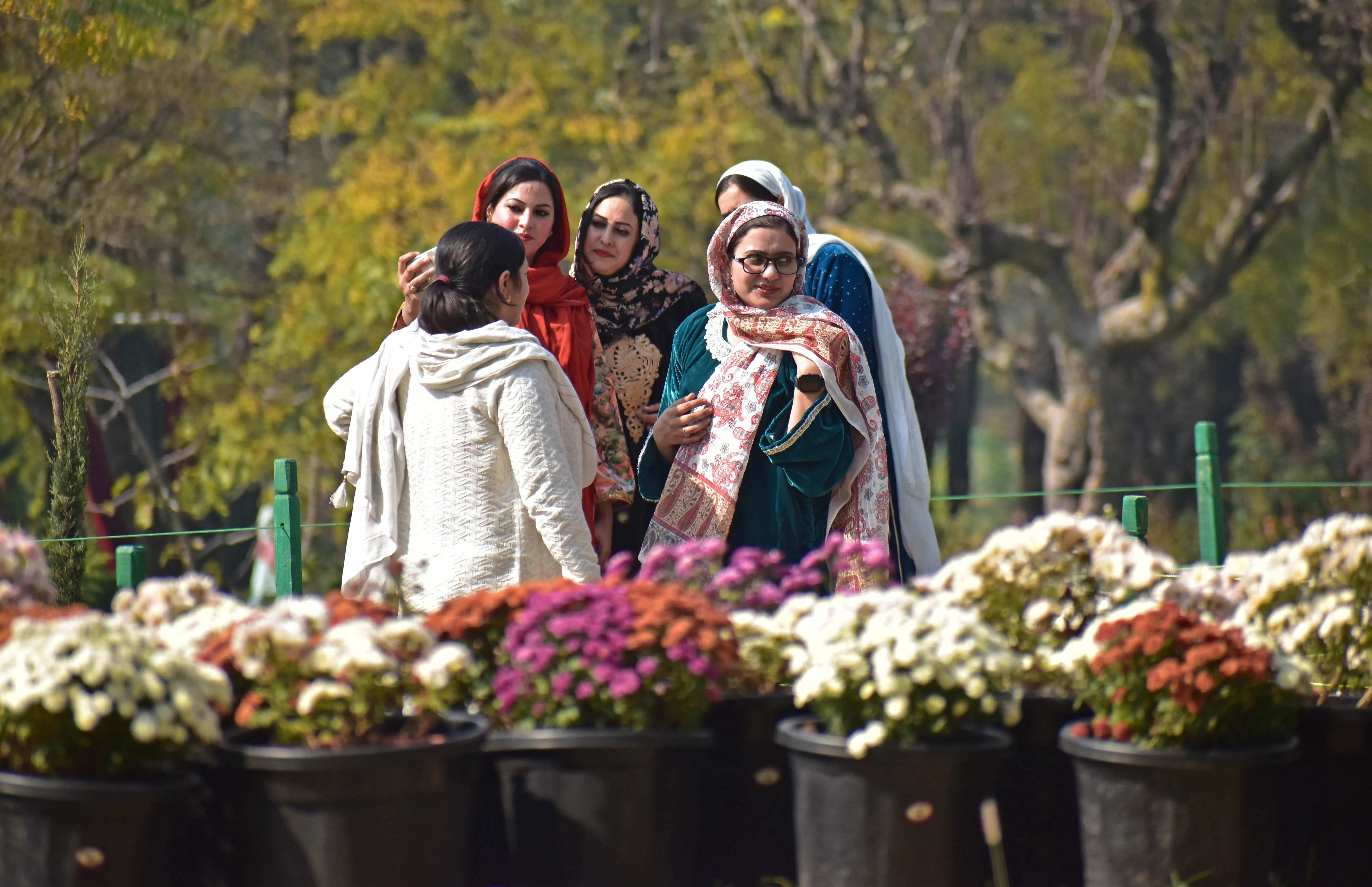 With smiles and laughter, groups of women enjoy their visit to Bagh-e-Gul-e-Dawood in Srinagar.