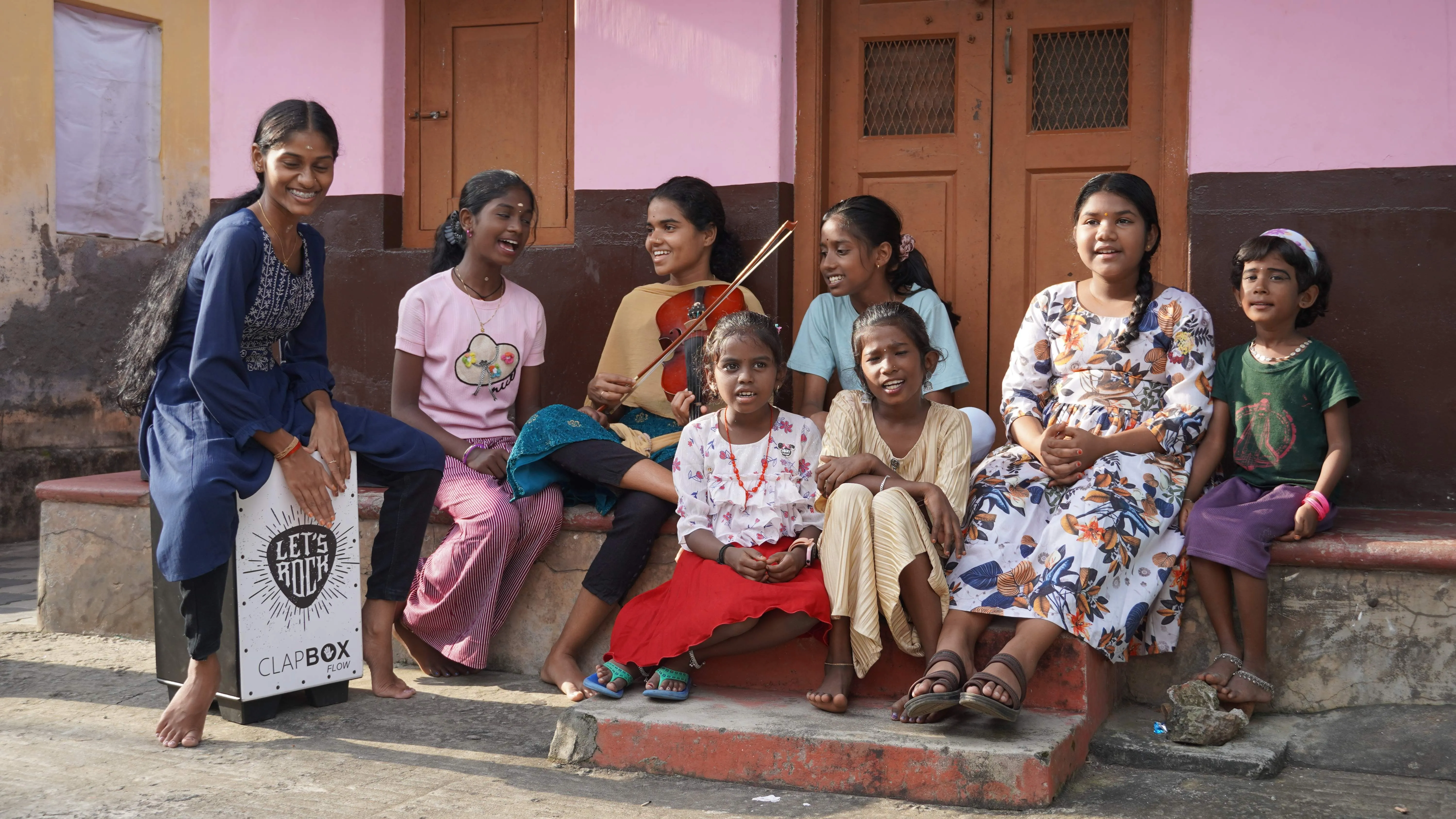 Young girls singing songs in the Music Village