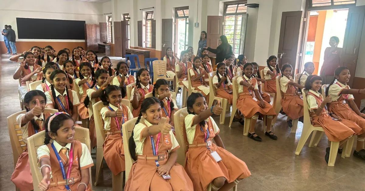 Volunteers use simple visuals and activities to explain menstruation in age-appropriate ways.